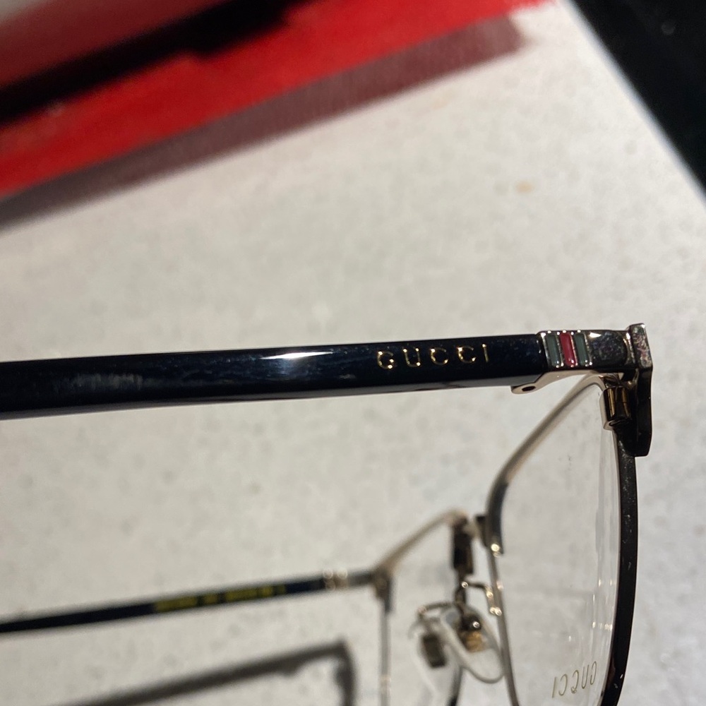 Gucci GG0130OZ 001 Elegant Black and Gold Eyewear - Picture 3 of 9